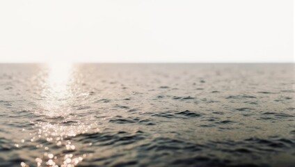Fototapeta premium Sunlight reflecting on the oceans surface, creating a shimmering effect.