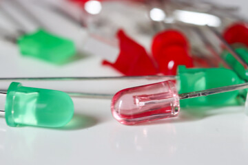 Red and Green LED Indicator Lights on White Background, Macro Electronics Detail