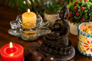 Meditation altar with Buddha statue, candles, plants