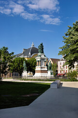 Park with fountain in the city center of Belfort in spring, France