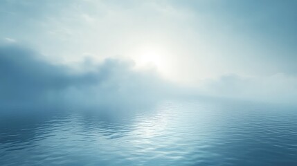 Calm water reflecting soft blue sky and pale light, misty clouds on the horizon creating a serene, ethereal seascape ideal for meditation, background, or copy space