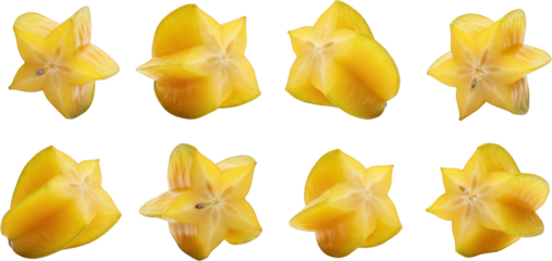 Sliced star fruit pieces arranged in various orientations showcasing yellow star shaped tropical fruit with visible seeds and texture on a clean surface