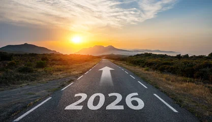 New year 2026 or start straight and beginning concept. Man ride on bike and the number 2026 start written on the road at sunset with lens flare. Concept of challenge or career path, business strategy. © AA+W