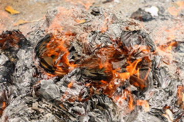 Burning accounting documents turning into ash and flames