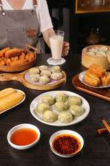 Traditional Asian Dim Sum Breakfast Spread with Dumplings and Fried Buns