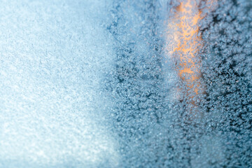 Snowflakes on glass, frosty day in winter