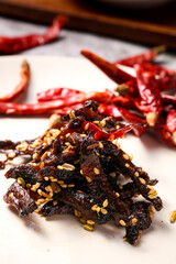 Spicy Deep Fried Meat with Savory Sauce and Sesame Seeds