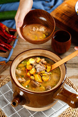 Chicken and Chestnut Soup in Clay Bowls - Traditional Asian Cuisine