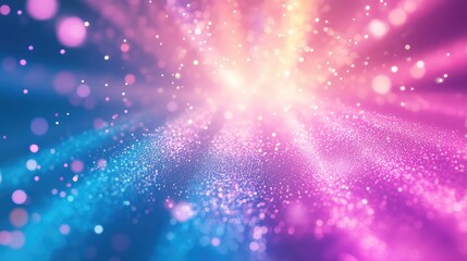 Obraz premium Abstract background showing bright light rays with shimmering particles and bokeh effects, creating a vibrant blend of blue, pink, and yellow hues representing energy and celebration