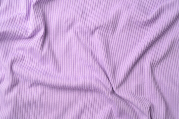 Purple fold knitted fabric background and texture.The fabric features a prominent vertical rib texture. © odinz