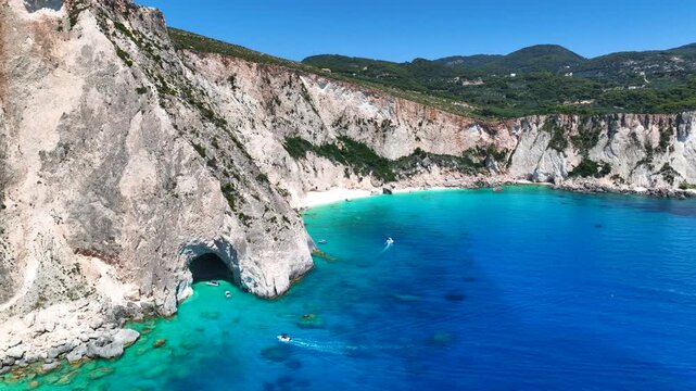Aerial drone cinematic video of scenic cave of Eros visited by boats and yachts in northern part of Myzithres islets a true paradise in island of Zakynthos, Ionian, Greece