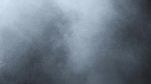 Smoke. Cloud of cold fog in blue light spot on black background. Abstract white smoke in slow motion. Light, white, fog, cloud, abstract, smoke, black, background, 4k, ice smoke cloud. Floating fog.	