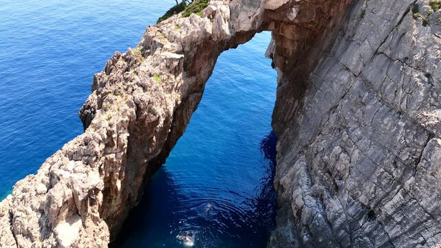 Aerial drone cinematic video of paradise fjord shaped bay and exotic caves of Korakonisi, Zakinthnos island, Ionian, Greece