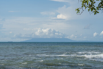 View of Mount Krakatau covered in clouds, view of mountains and sea in Indonesia