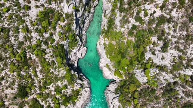 Aerial drone video of of Porto Stenitis famous fjord shaped bay with crystal clear turquoise sea and small beach  ideal for snorkeling visited by small tourist boats, Zakinthos island, Ionian, Greece