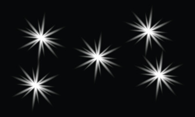 Star Burst And Sparkle Light Effects On Black Background &ndash; star burst, sparkle light, glowing stars, light flare, shine effect