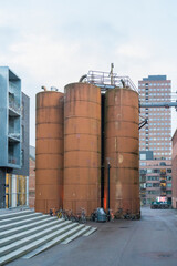 Rusty cylinder shaped water towers, for district heating