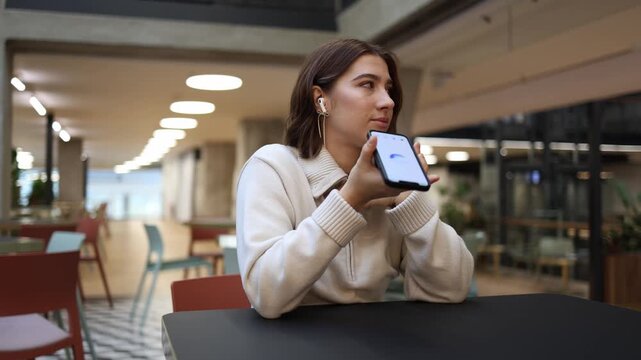 ChatGPT builds confidence as young woman feels proud and supported holding phone after receiving encouragement and positive feedback during conversation