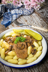 Braised pork loin with mushrooms.