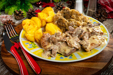 Stewed pork loin in a sauce with chanterelles.
