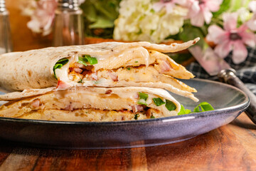 Tortilla multigrain with omelette, sausage and bacon.