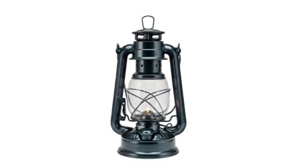 Vintage dark metal oil lantern with a glass globe and a lit wick on a white background