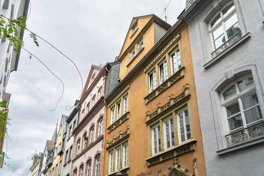 View of colorful buildings standing side-by-side with their windows reflecting the sky above, creating a vibrant urban tapestry, Koblenz Mitte, Rhineland-Palatinate, Germany.