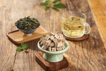 Traditional Kudzu Root Rhizome and Herbal Tea Medicine Preparation on Wooden Background
