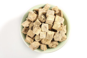 Dried Kudzu Root Rhizomes in Bowl - Traditional Herbal Medicine Ingredient for Natural Health Benefits