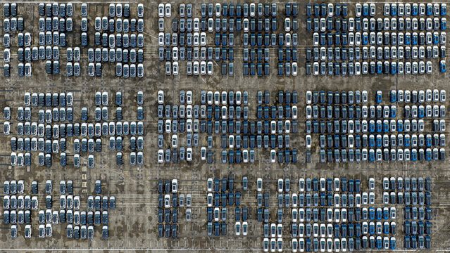 Aerial view of orderly rows of parked cars create a mesmerizing geometric pattern from above in Tanjong Pagar Terminal, Singapore, Singapore.