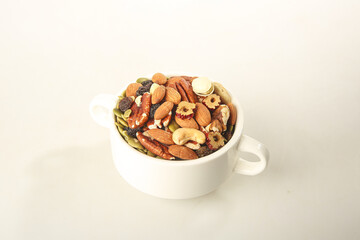 Healthy Mixed Nuts and Dried Fruits in White Cup - Daily Nutritious Snacks