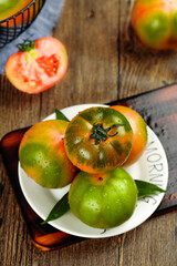 Fresh Heirloom Tomatoes on Rustic Wood Table - Organic Garden Vegetables