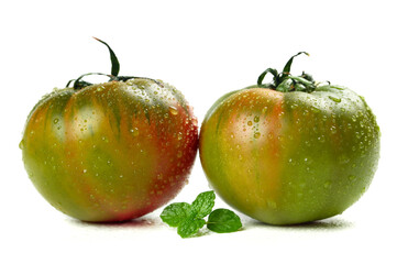 Fresh Green Tomatoes with Water Droplets and Mint Leaves on White Background