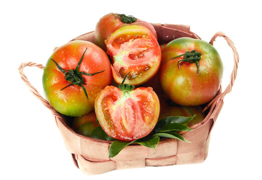Fresh Ripe Tomatoes in Wicker Basket - Organic Vegetables for Healthy Cooking