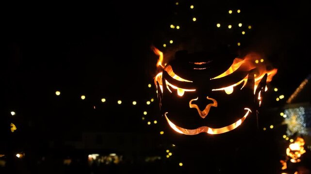 Krampus Festival in Europe. Burning head, blazing flame at night slow motion