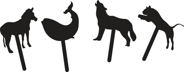 Silhouette animal figures on sticks