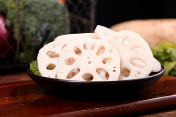 Fresh Lotus Root Slices in Black Bowl, Honghu Hubei
