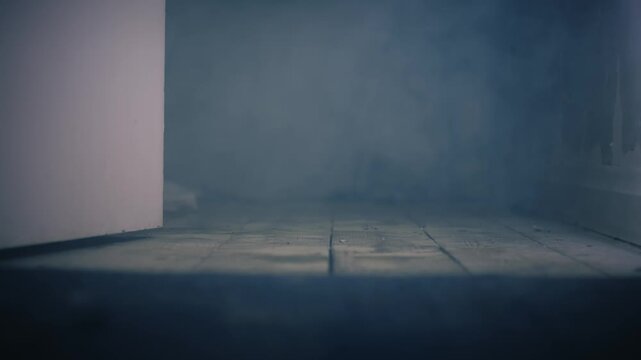 Room full of smoke with open door