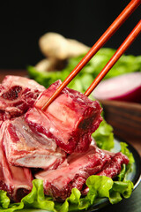 Fresh Raw Beef Steak with Chopsticks and Green Vegetables