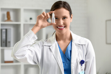 Female ophthalmologist with eye drops in clinic