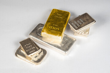Gold and Silver Bars on white table top view