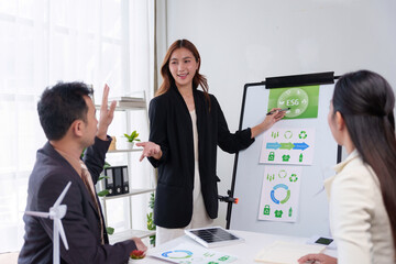 Colleagues discussing environmental, social, and governance - ESG - strategy during a meeting, focusing on corporate sustainability goals