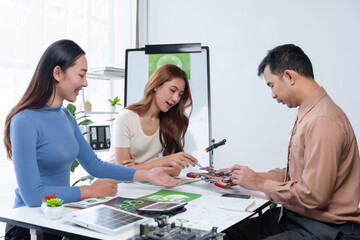 Fototapeta premium Team of engineers discussing and developing a new eco friendly project using sustainable technology and solar energy