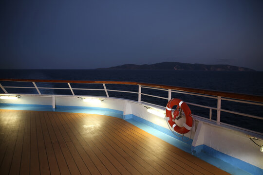 Twilight over a cruise ship deck; a relaxing way to travel, sailing across the calm ocean.