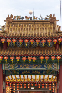View of a traditional Chinese archway adorned with strings of vibrant red lanterns, creating a festive and culturally rich atmosphere, Kuala Lumpur, Federal Territory of Kuala Lumpur, Malaysia.