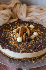 Homemade lotus cheesecake recipe for celebrations with chocolate and cookies