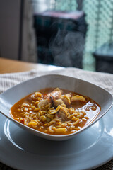 Homemade recipe for seafood noodle soup on a kitchen table 