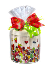 Isolated present with a can of sweets in a cellophane foil
