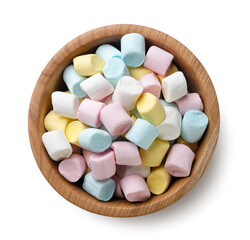 Colored marshmallows in a wooden plate on a white. Top view