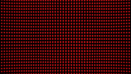Close up of a red background with black dots. The dots are arranged in a grid pattern